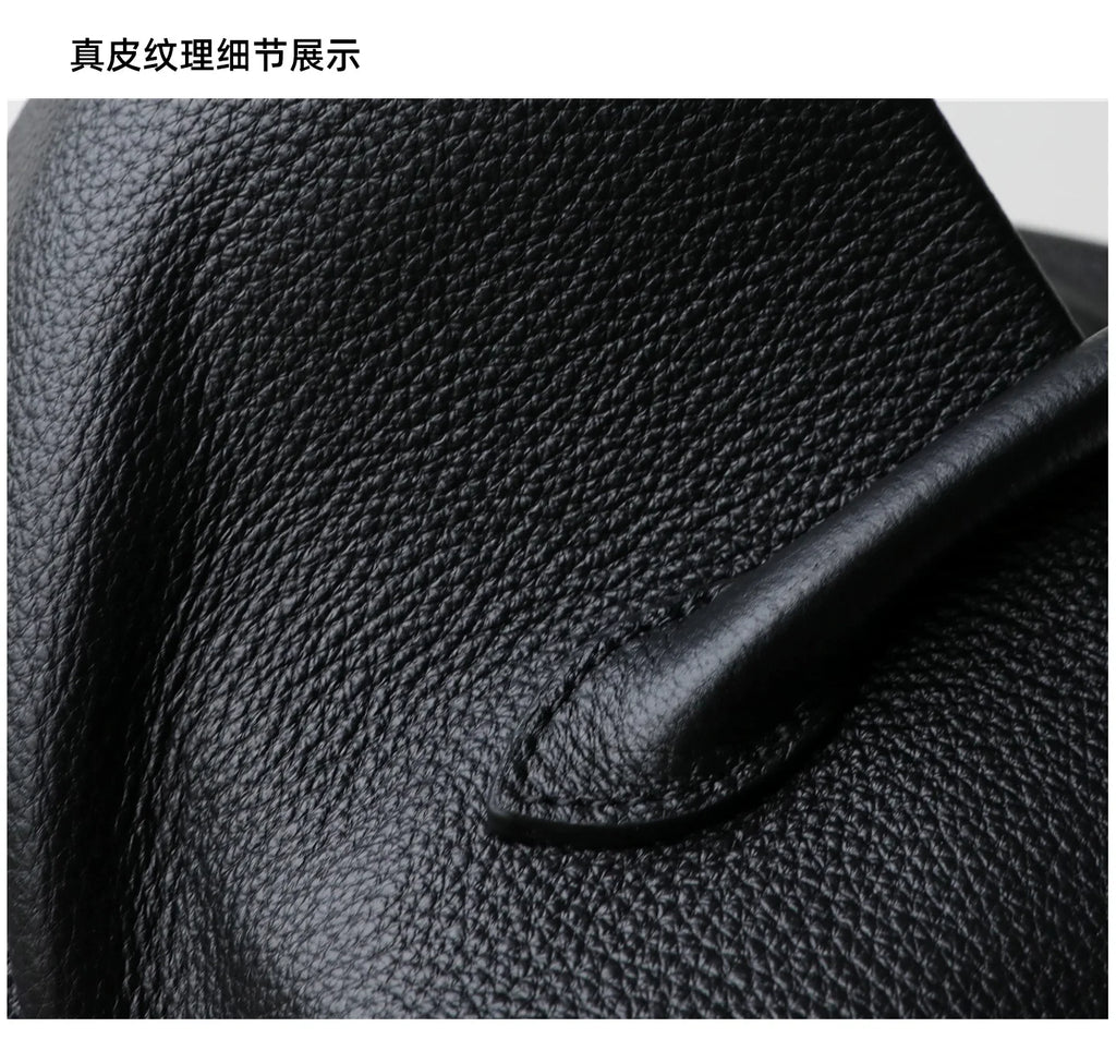 Close-up of black leather texture with a pen on top