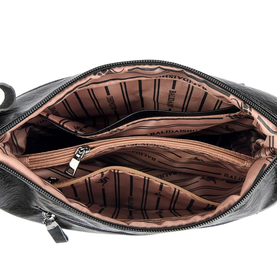 Open black handbag with striped interior on a white background