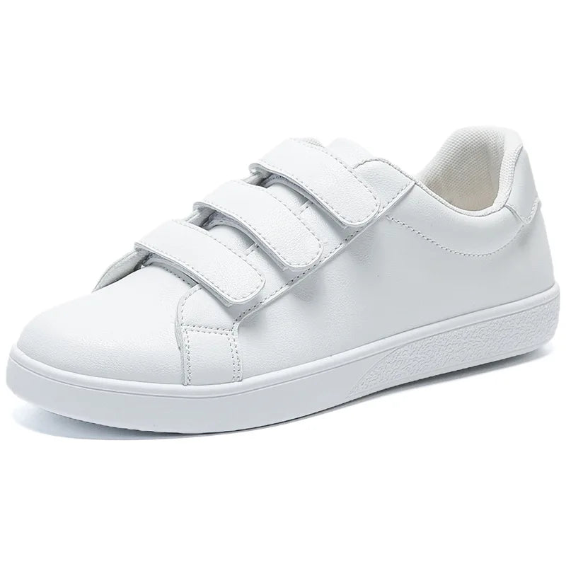 White sneaker with velcro straps on a white background