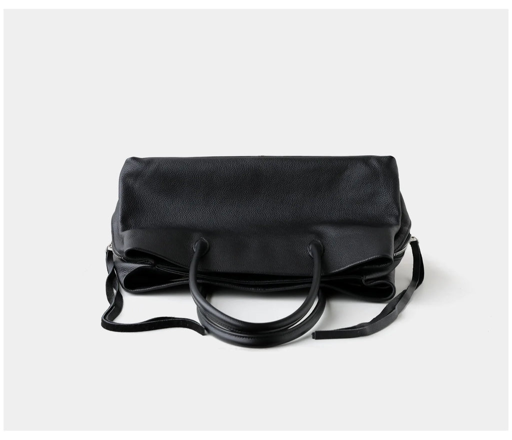 Black handbag on a white background