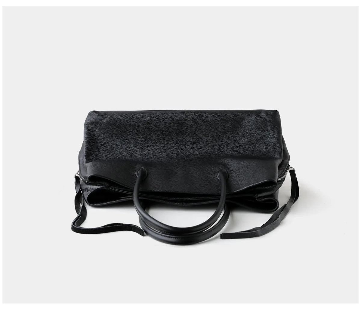 Black handbag on a white background