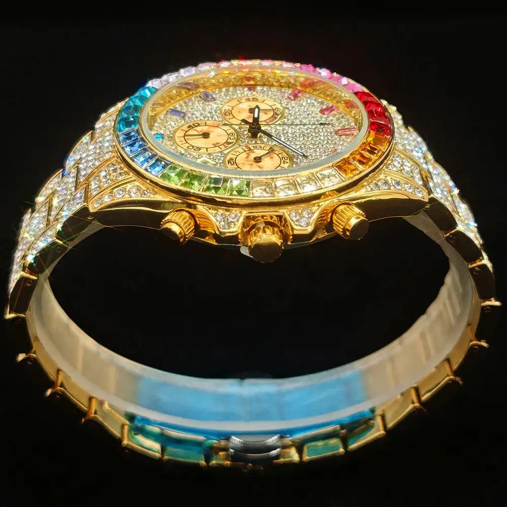 Luxury watch with colorful face and gold casing on a black background