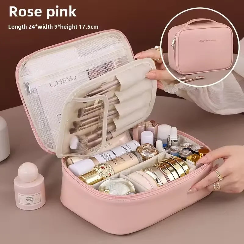 Rose pink cosmetic bag with makeup items on a brown background