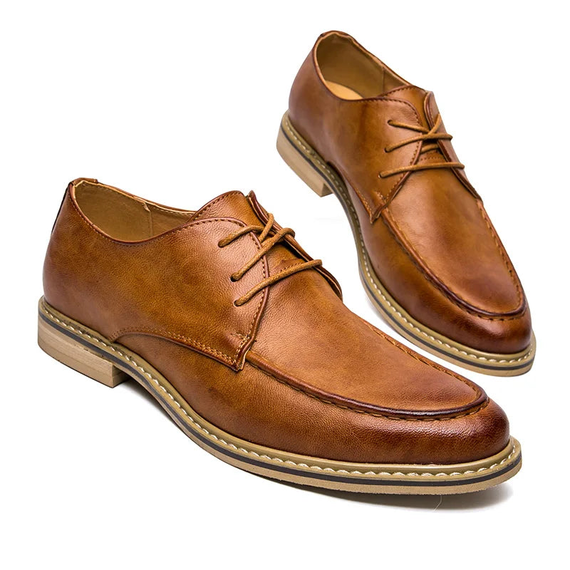 Pair of brown leather shoes on a white background