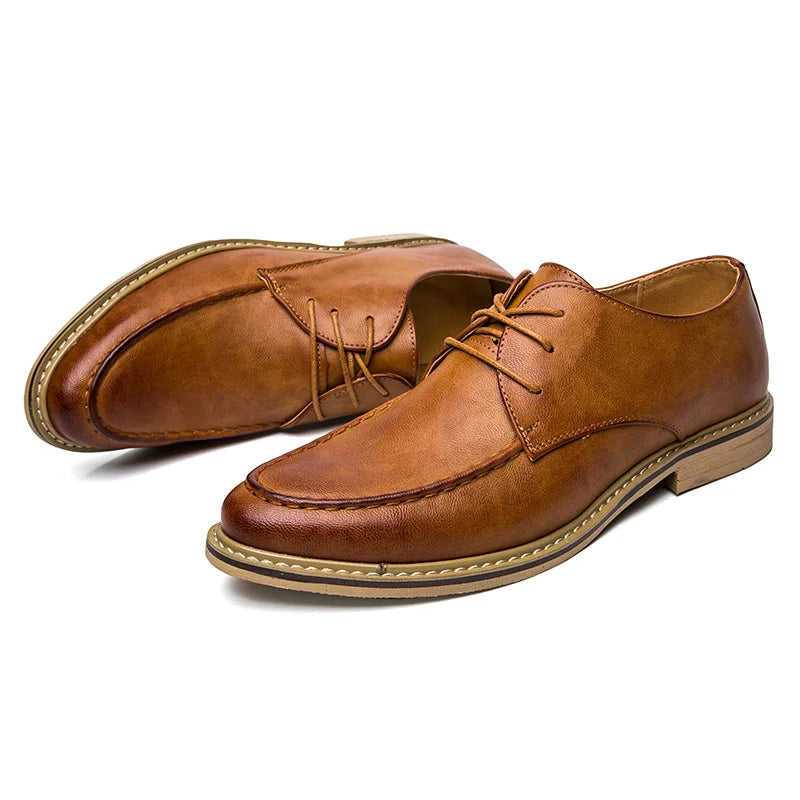 Pair of brown leather shoes on a white background