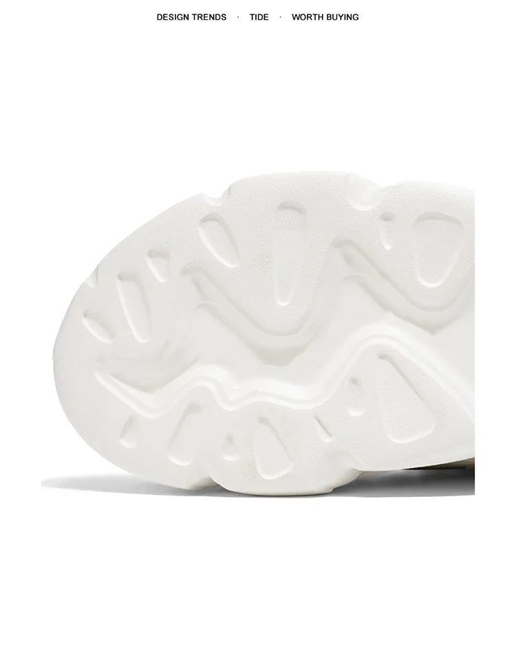 White sneaker with textured sole on a white background