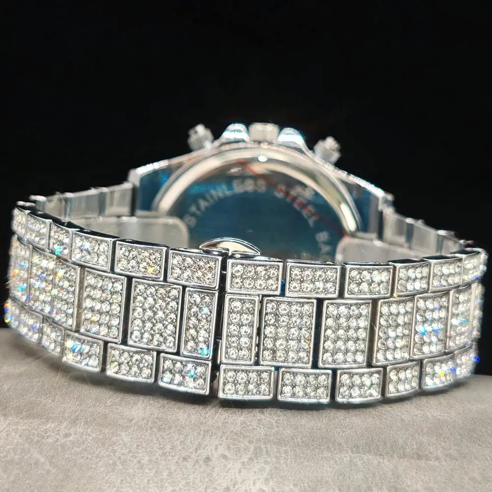 Silver-tone stainless steel watch band with a link design fully paved with clear cubic zirconia stones, shown from the back on a textured gray surface against a black background.