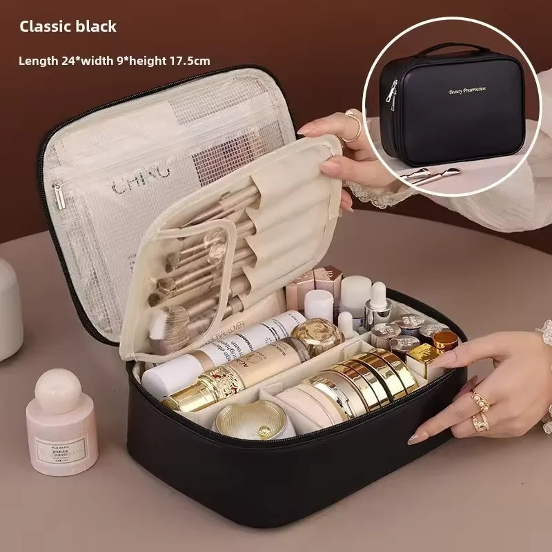 Black cosmetic travel case with makeup items and a hand holding it open.