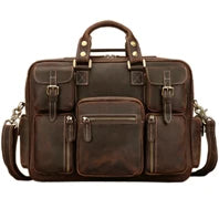 Brown leather briefcase with multiple pockets on a white background
