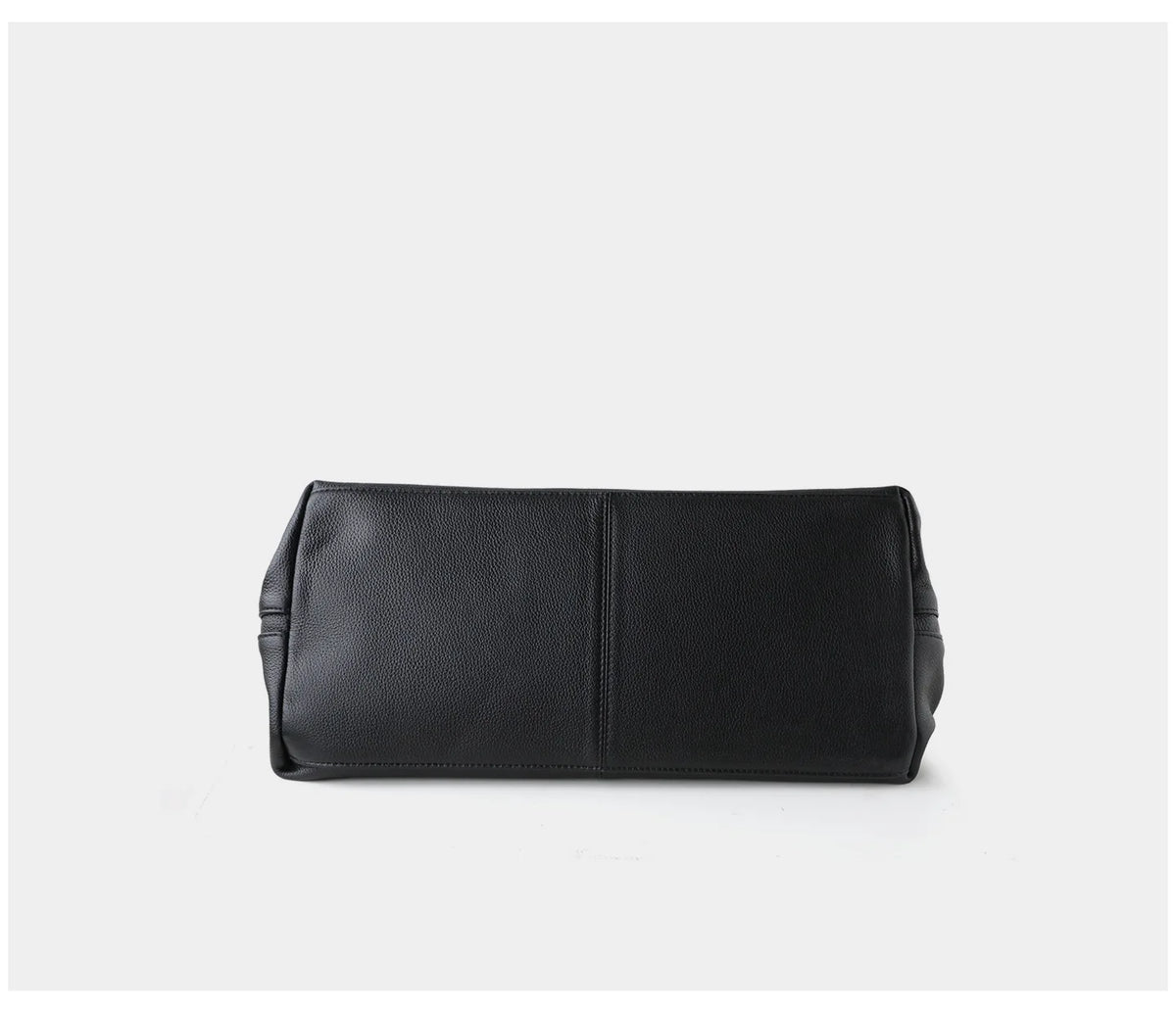 A black textured leather clutch or pouch bag shown from the bottom against a clean white background.