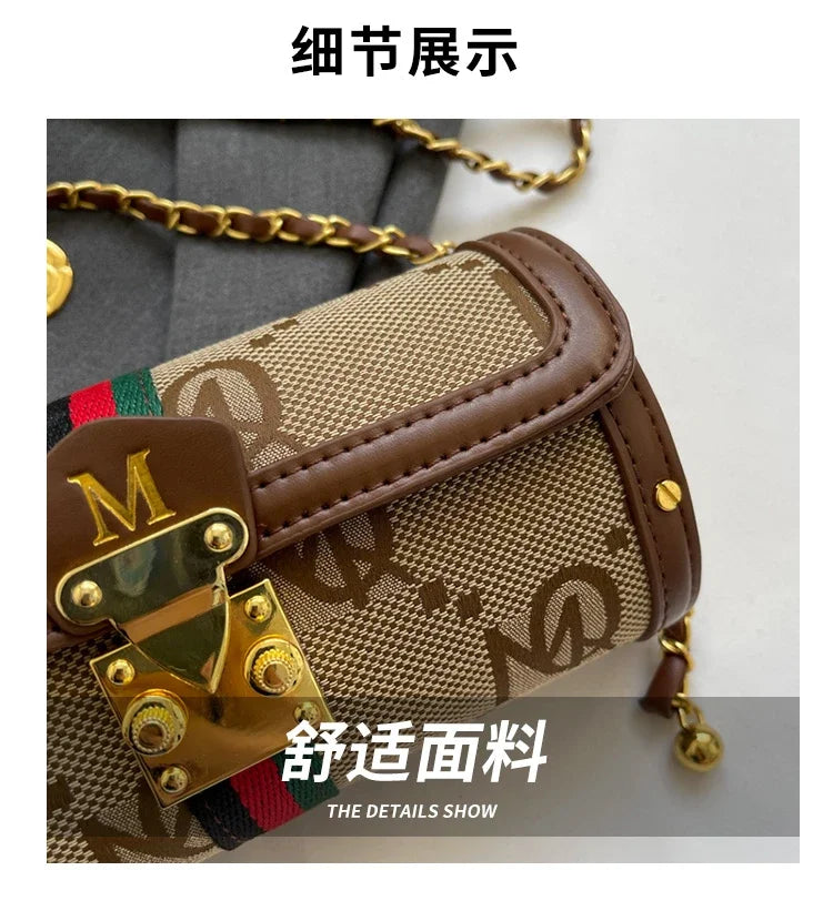 Designer handbag with visible brand logo on a neutral background