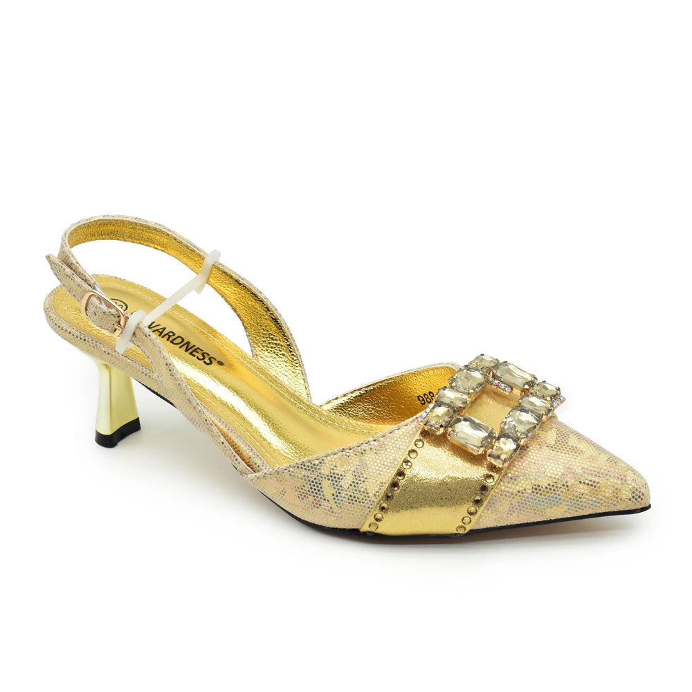 Gold high-heeled shoe with embellishments on a white background