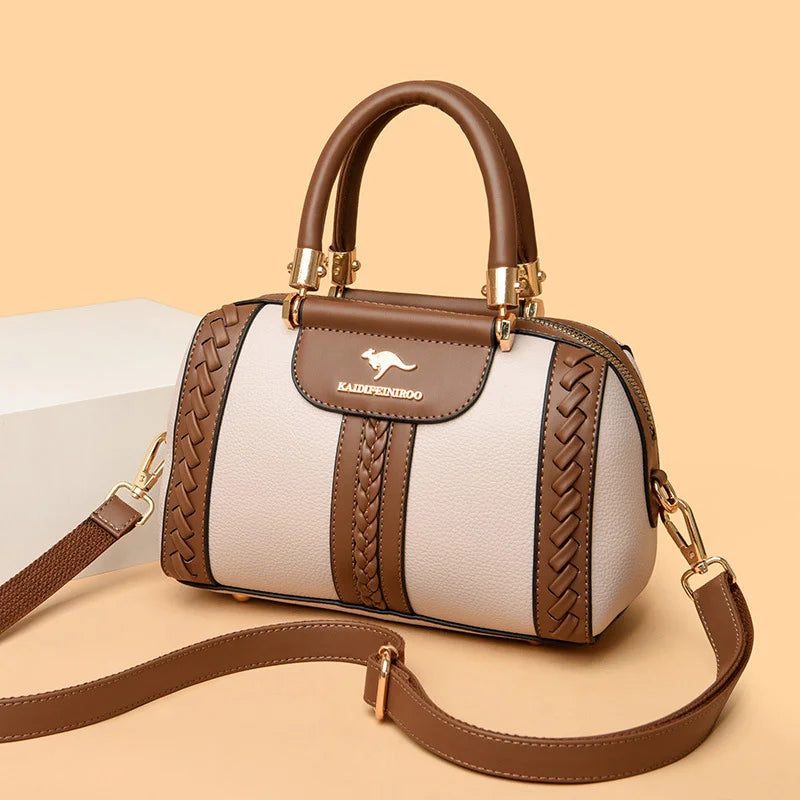 Handbag with brown and white design on a beige background