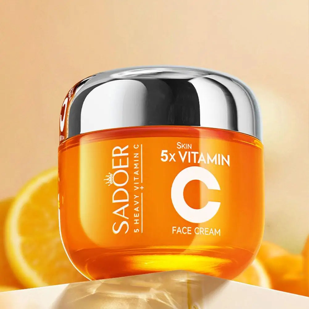 Sadoer Vitamin C face cream jar with oranges in the background