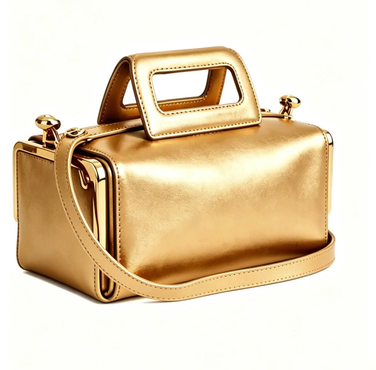 A metallic gold handbag with a structured rectangular shape, a top handle, and a shoulder strap, photographed on a clean white background.