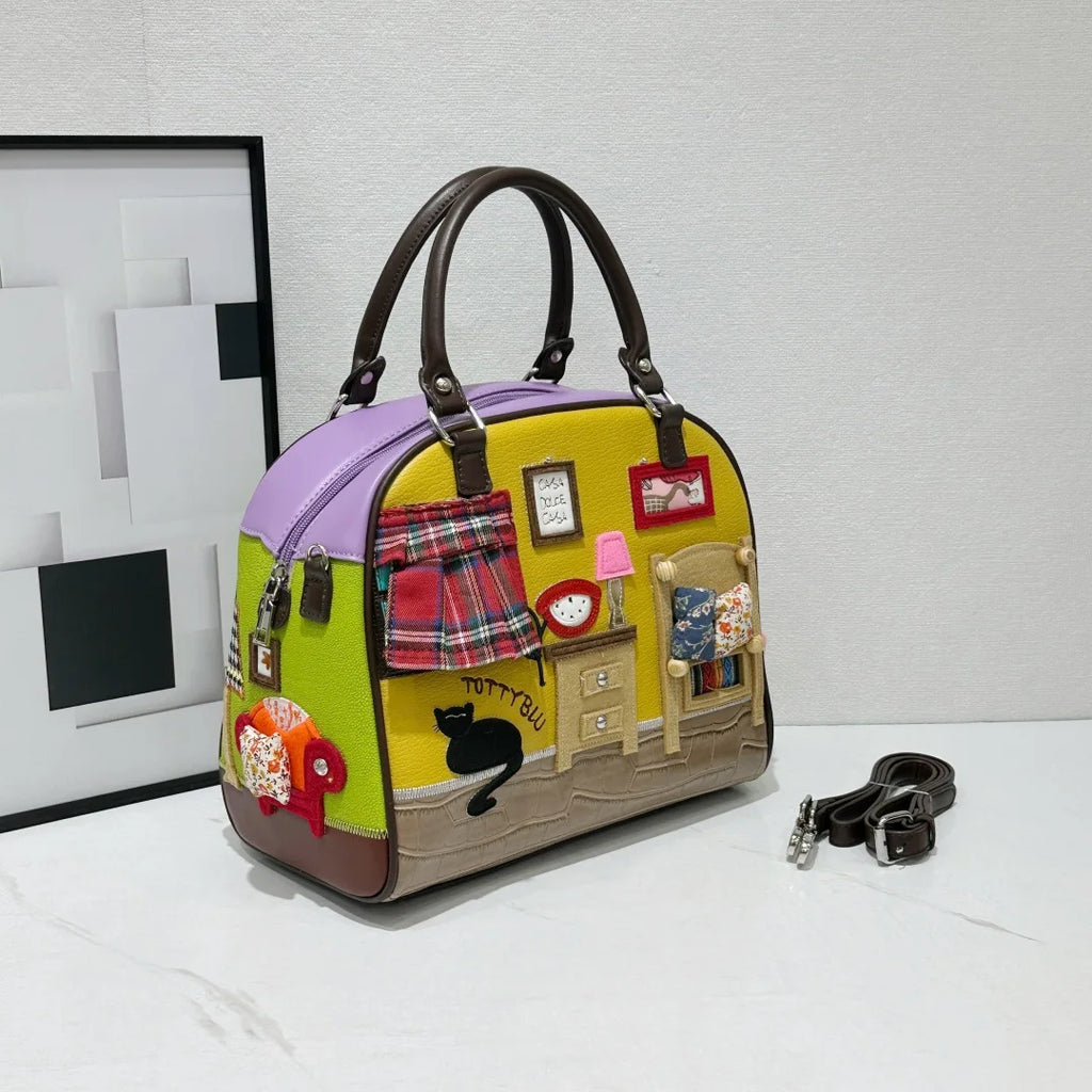 Colorful handbag with decorative elements on a white surface