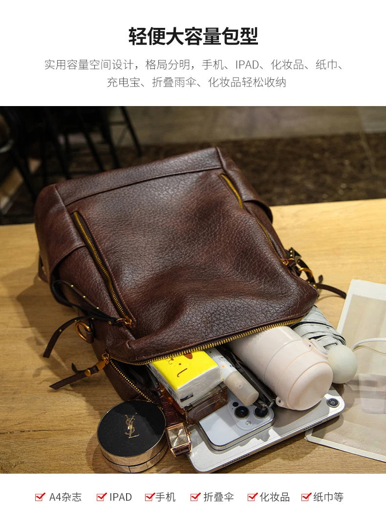 A brown pebbled leather handbag shown open on a wooden table, filled with various items including a phone, charger, compact, and folded umbrella. Chinese text is displayed at the top and bottom describing the bag's large capacity and organizational features.
