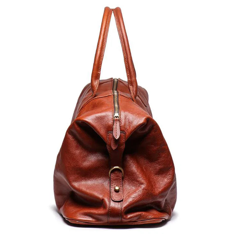 Brown leather duffel bag with gold zipper and buckle on a white background
