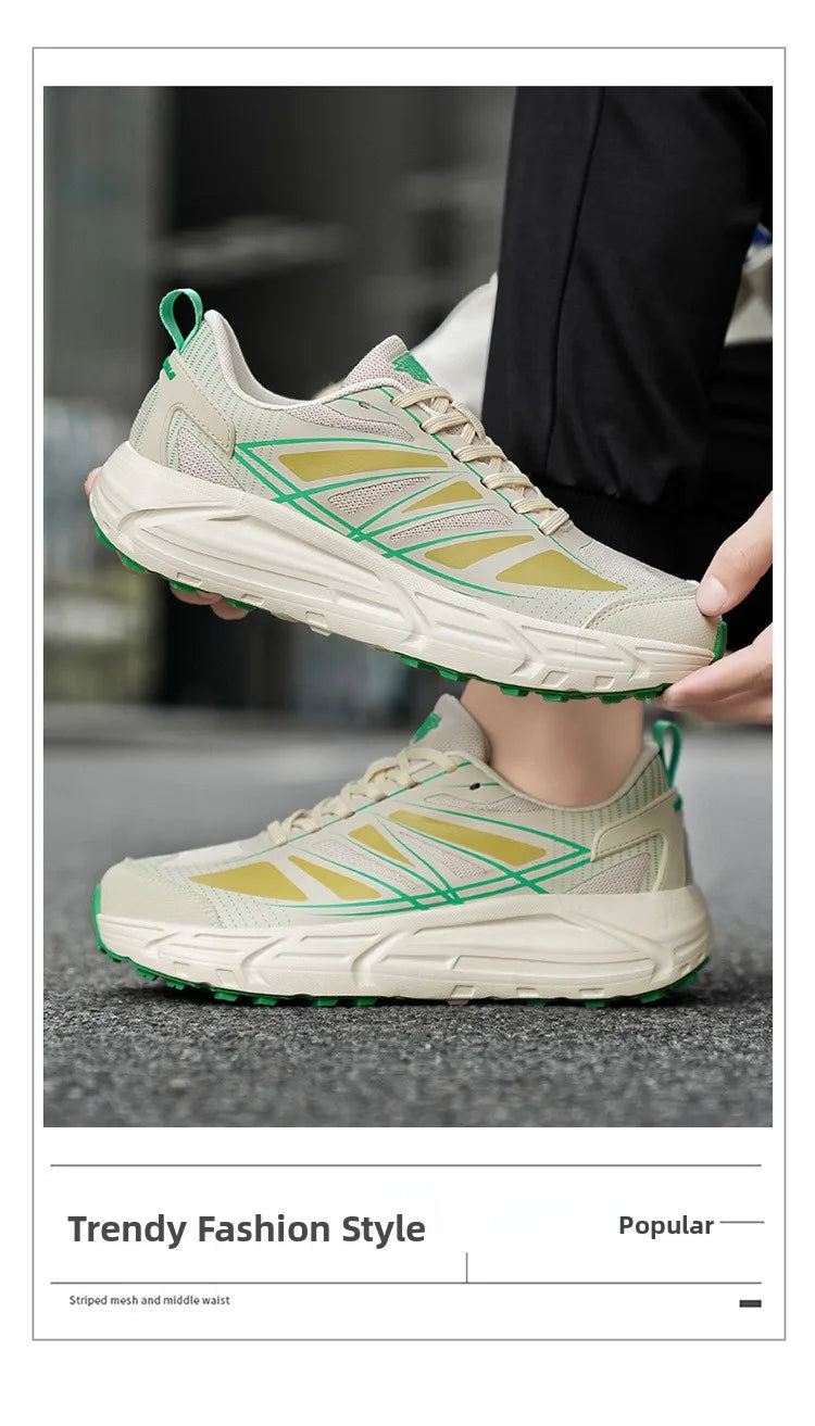 A pair of low-top athletic sneakers shown on a person's foot and held above the foot, with a real outdoor ground surface in the background. The shoes are off-white/cream with pale yellow panels and bright green stripe accents, plus a chunky white sole.