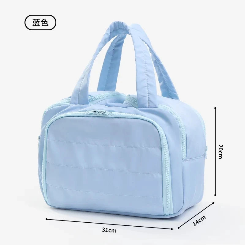 Light blue handbag with dimensions on a white background