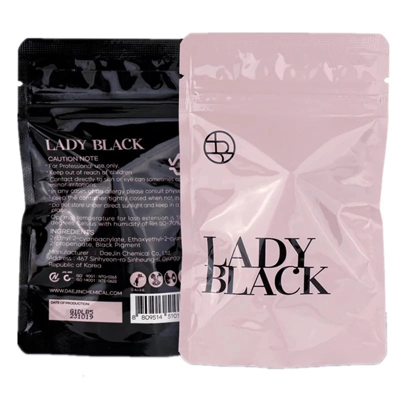 Two 'LADY BLACK' packages, one black and one pink, on a white background.