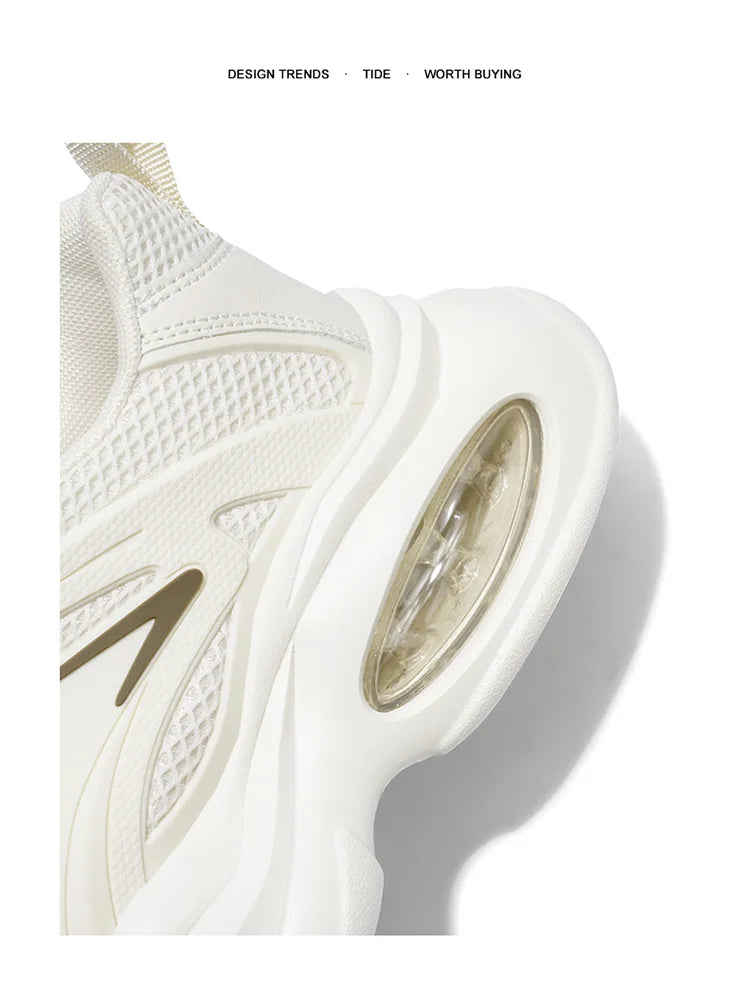 White sneaker with gold accents on a white background