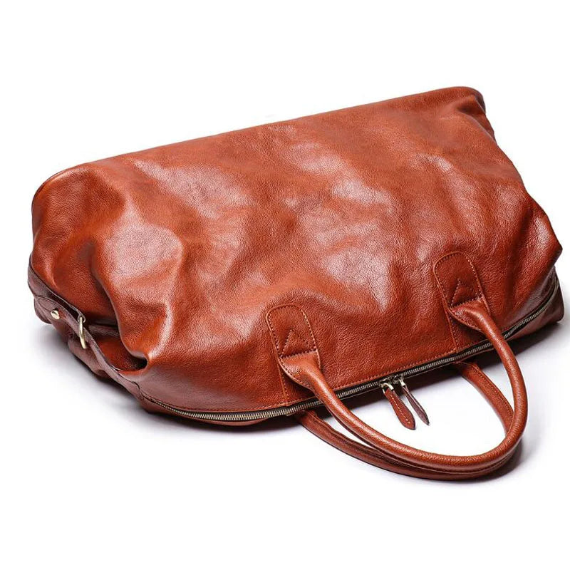 Brown leather bag on a white background