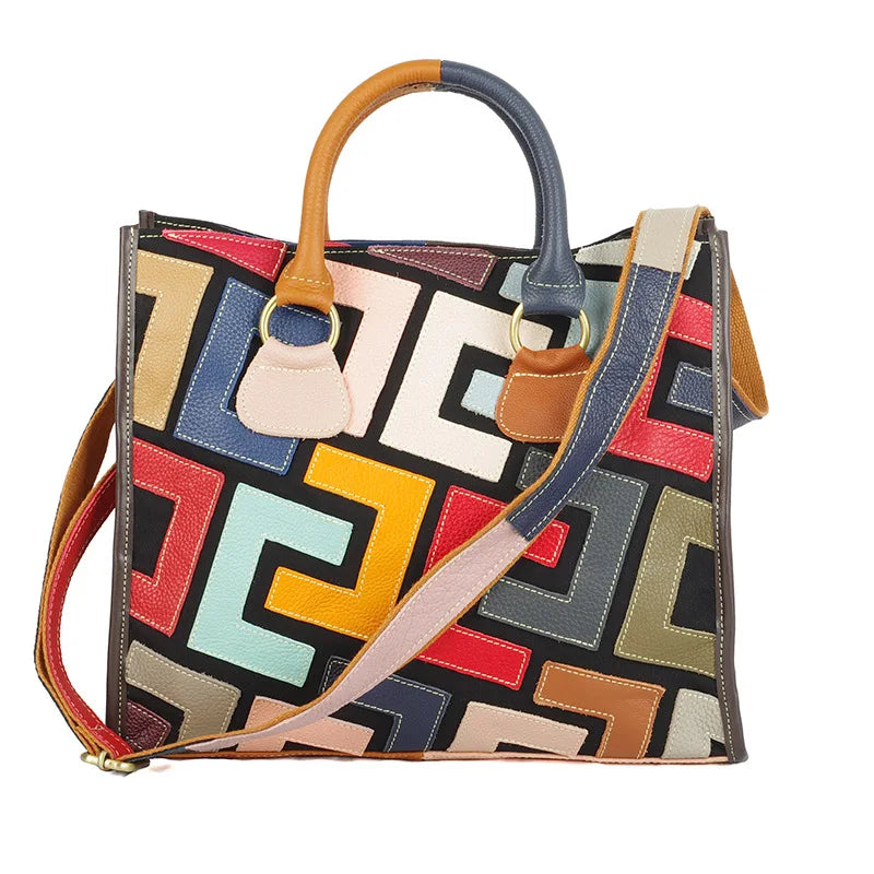 Colorful geometric-patterned handbag with a shoulder strap on a white background