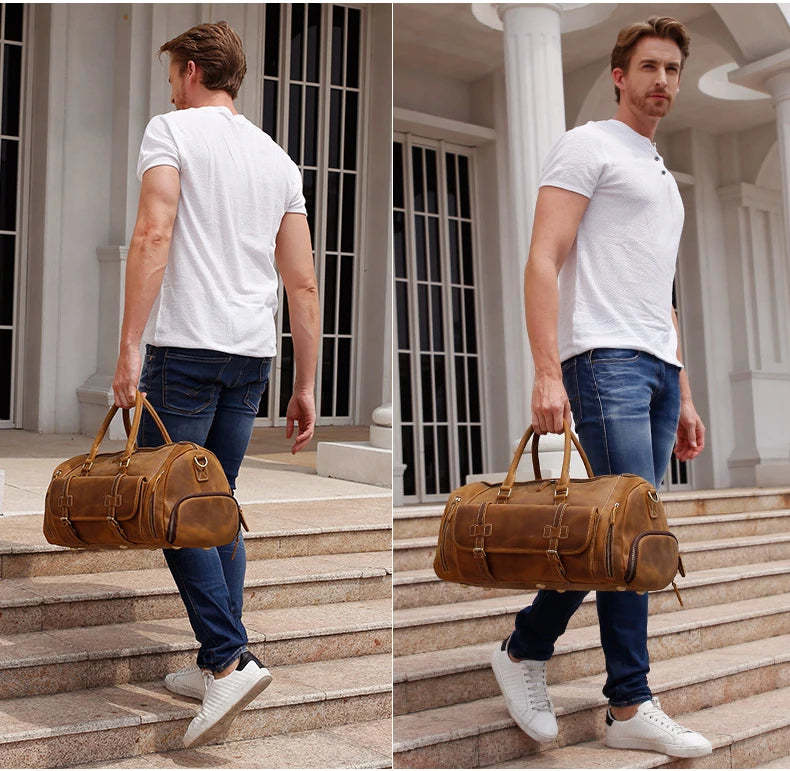 Man holding a brown leather duffel bag on stone steps