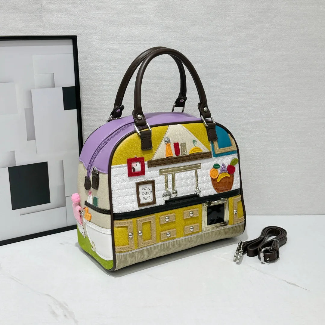 Colorful handbag with a house design on a white surface