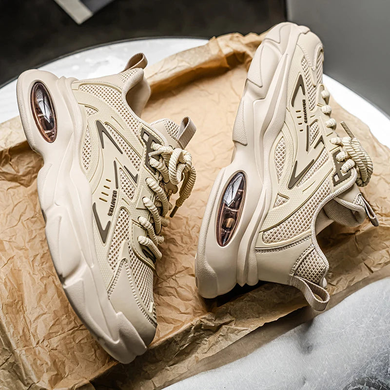 Pair of beige sneakers on crumpled brown paper with a blurred background