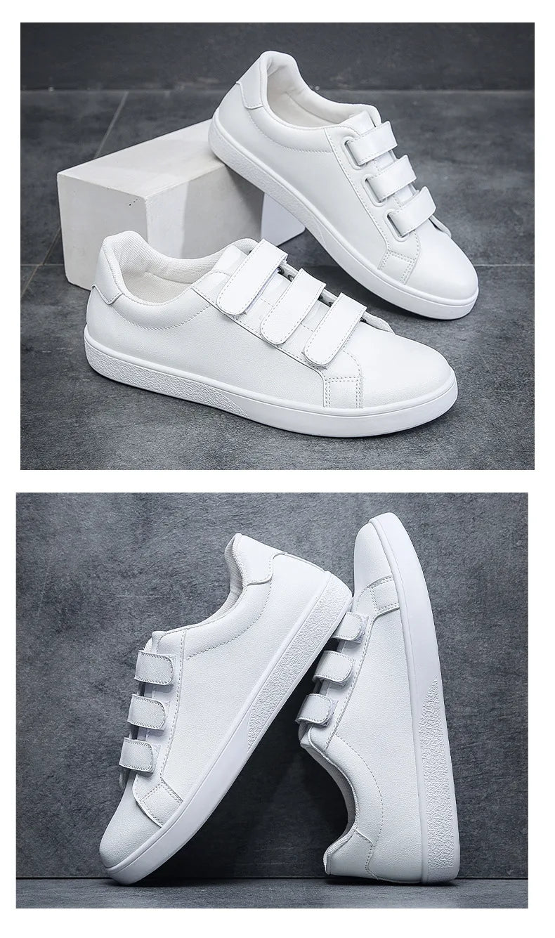 White sneakers with velcro straps on a dark gray background