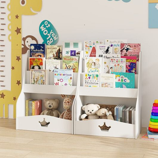 Children's bookshelf with books and toys against a wall with a giraffe decoration.