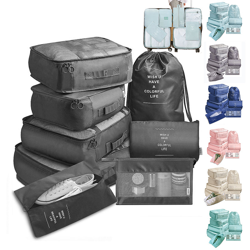 Travel packing cubes set flat lay showing all 8 pieces in beige nylon on white background