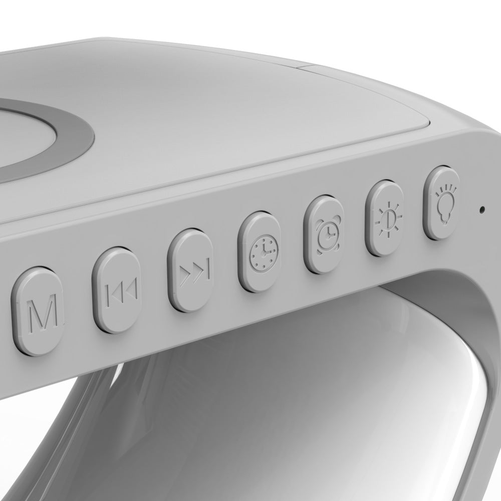 Close-up of a white electronic device with control buttons on a white background