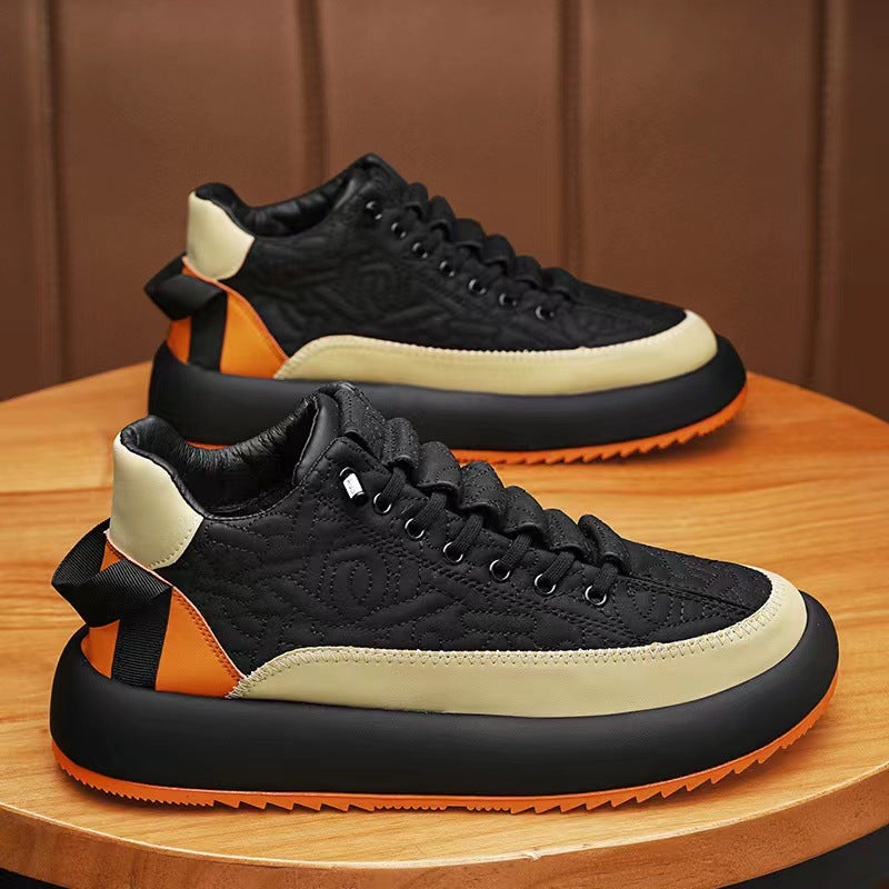 Black and orange sneakers on a wooden surface with a brown background
