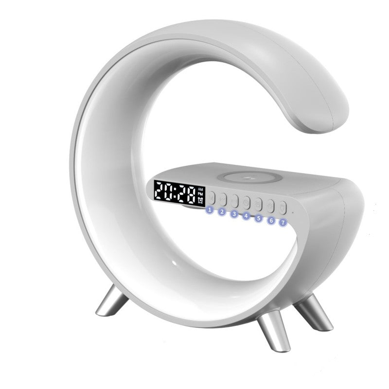 Modern white alarm clock with digital display on a white background