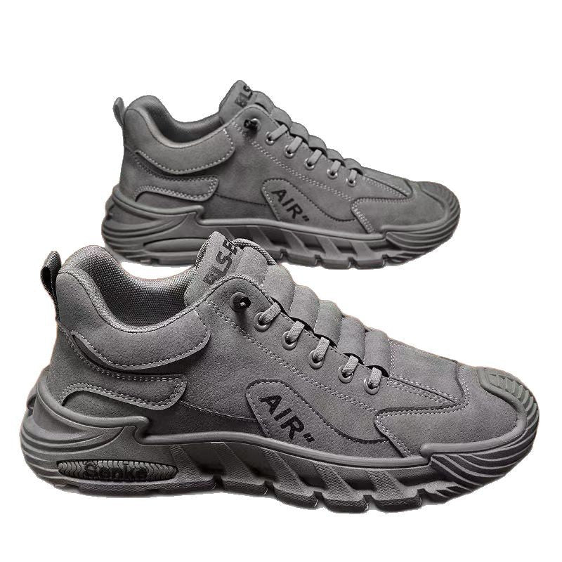 Gray sneakers with 'AIR' branding on a white background