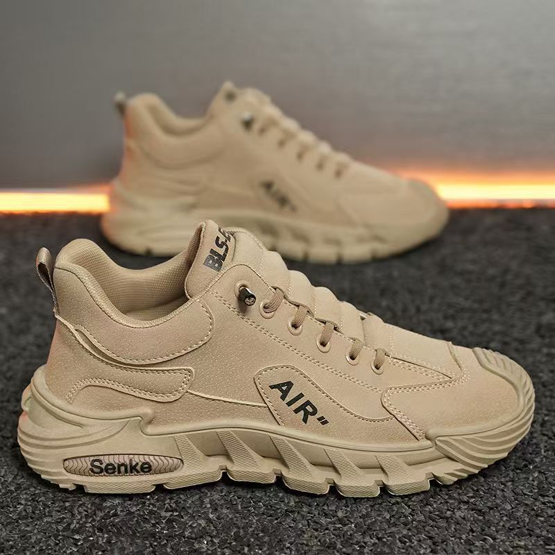 Beige sneakers with 'Air' branding on a dark textured surface