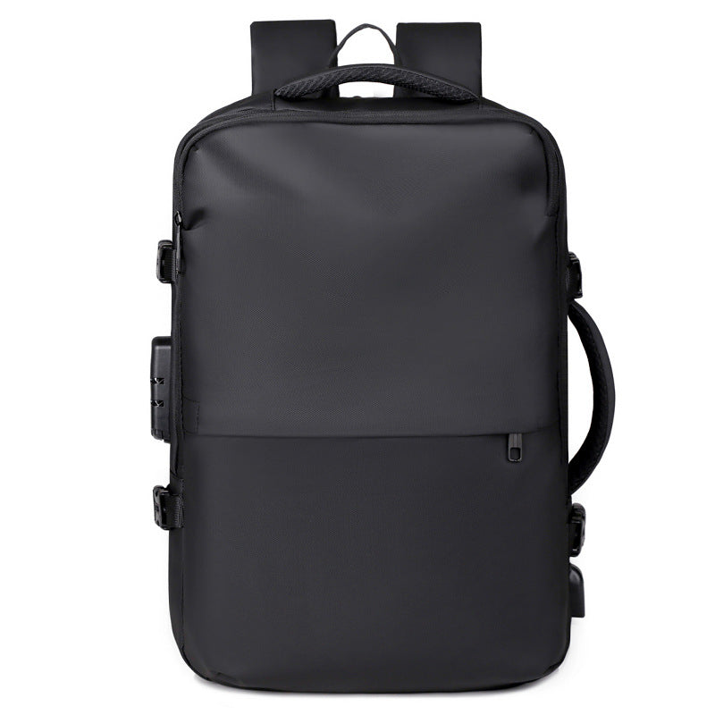 A black minimalist backpack with a top carry handle, side compression straps, and a front zippered pocket, shown against a clean white geometric background.
