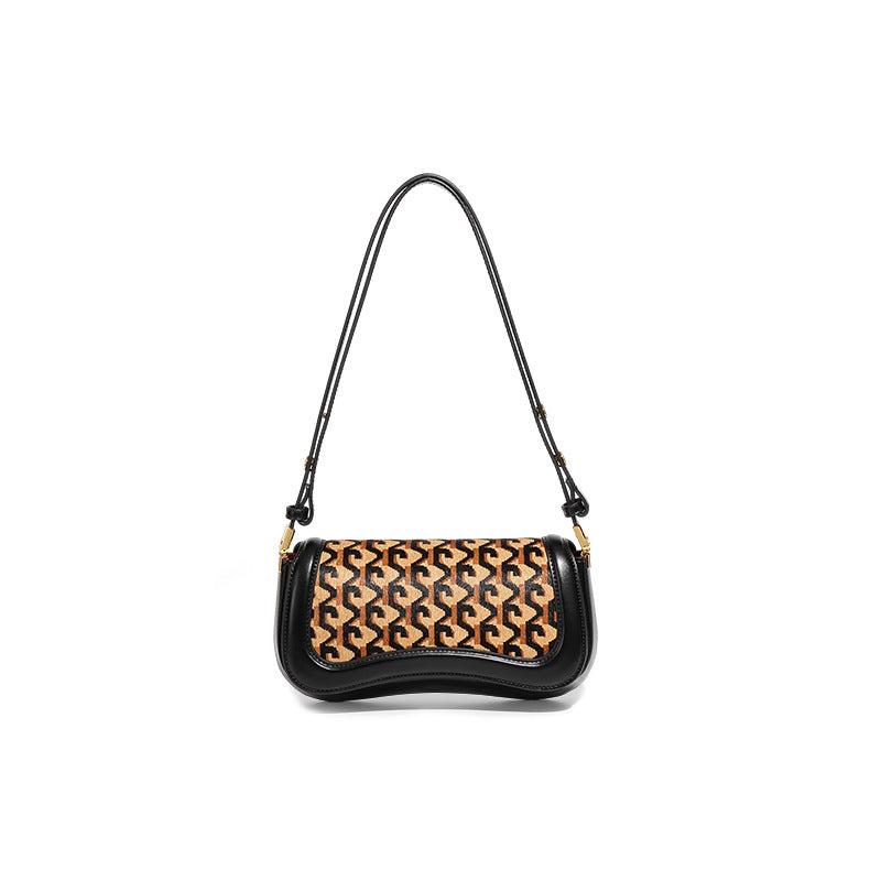 A black leather shoulder bag with a curved top, featuring a central panel of interlocking monogram pattern in tan and black, and a thin black shoulder strap with gold-tone hardware.