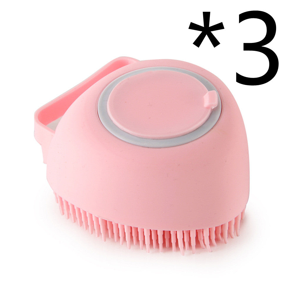 Pink silicone scrubber with bristles on a white background