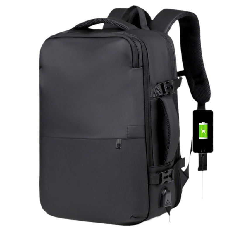 A black backpack with a side-mounted USB charging port, shown with a black power bank plugged in against a plain white background.