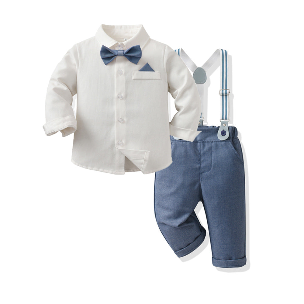 A baby boy's formal outfit set consisting of a cream long-sleeve shirt with a blue bow tie and pocket square, blue shorts, and white suspenders with blue stripes.