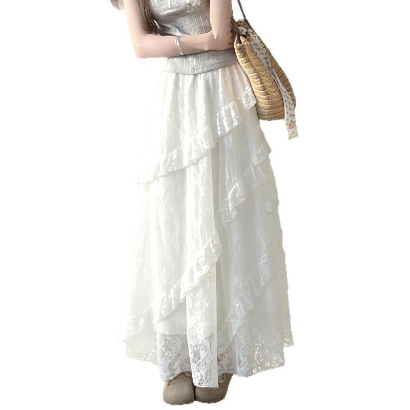 White lace dress with a straw bag on a white background