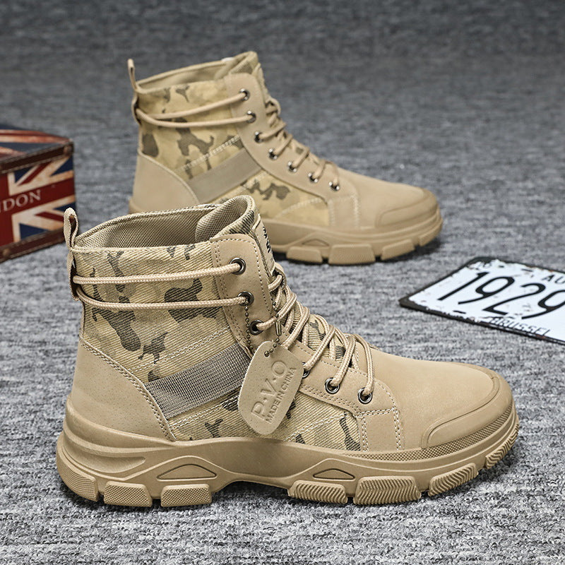 Tan tactical boots with camouflage pattern on a textured surface